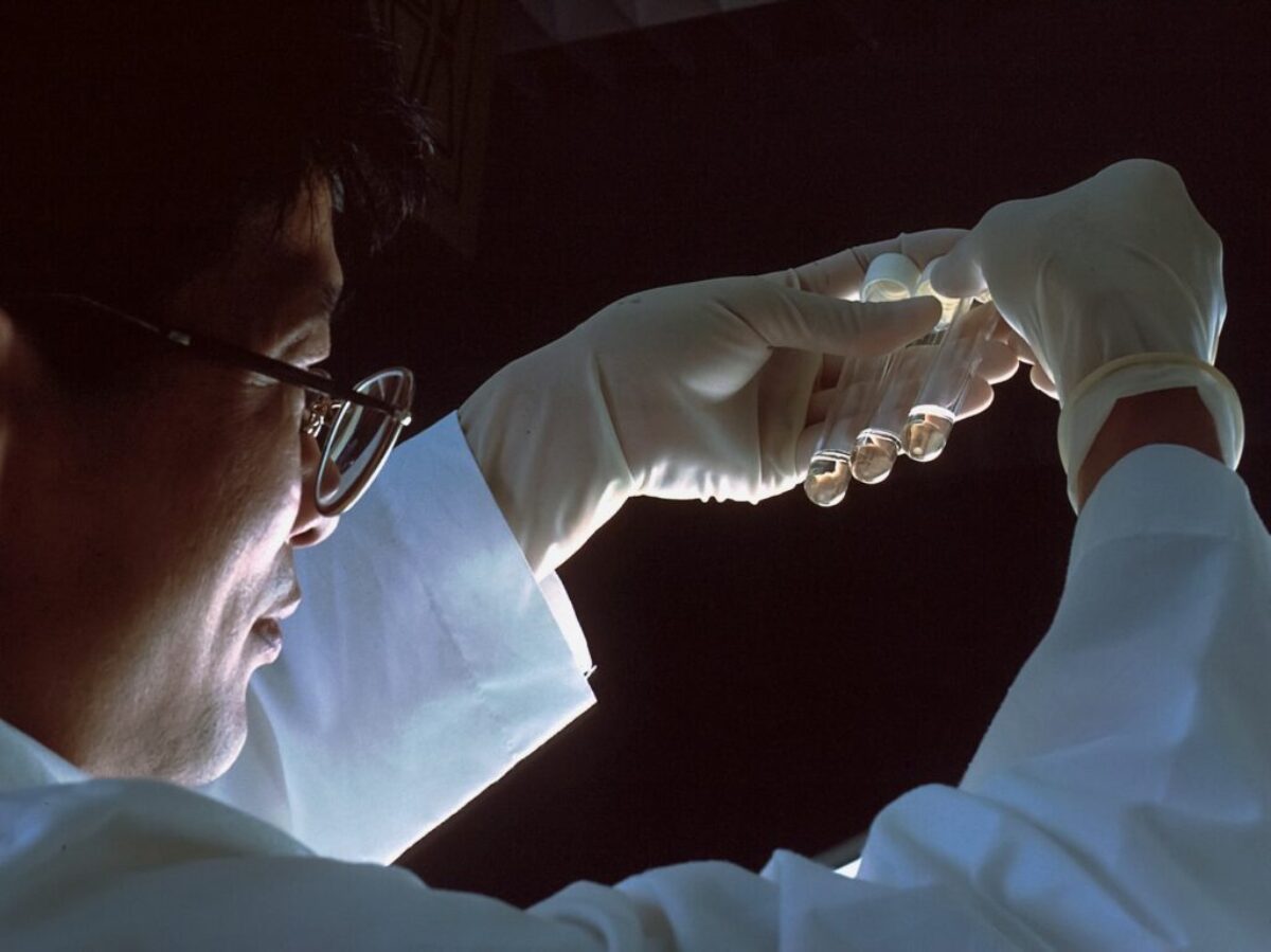 person in brown long sleeve shirt wearing silver framed eyeglasses