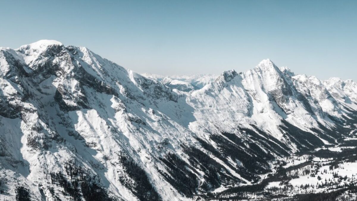 snow covered mountain under blue sky during daytime