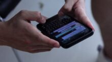 person holding black iphone 4
