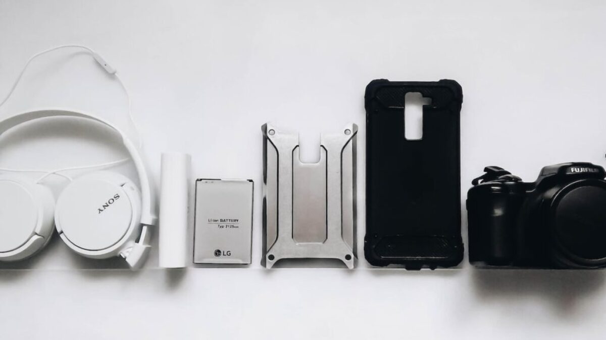 white Sony headphones and black smartphone case