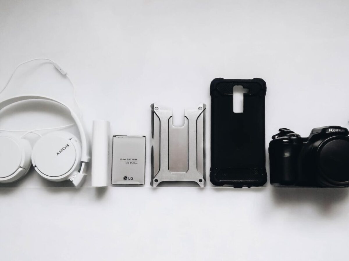white Sony headphones and black smartphone case