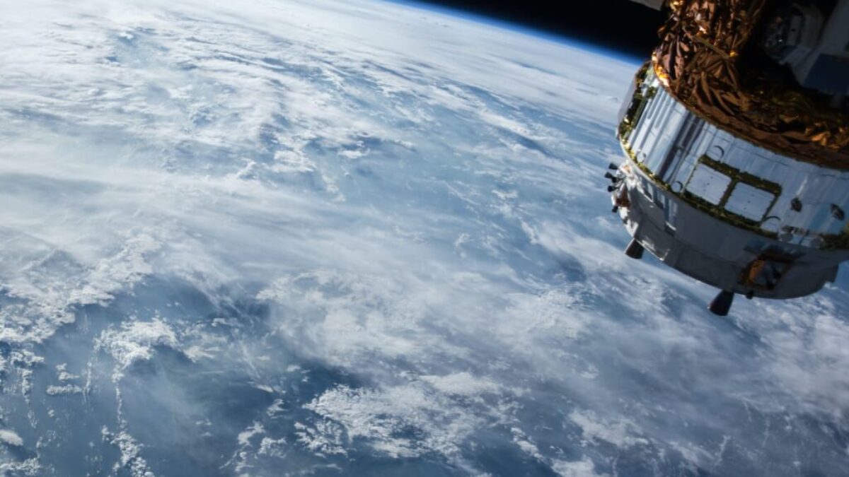 view of Earth and satellite