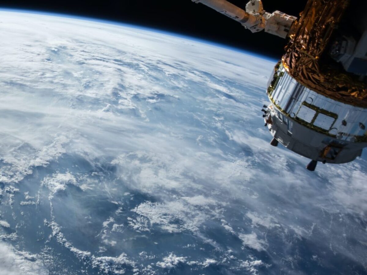 view of Earth and satellite