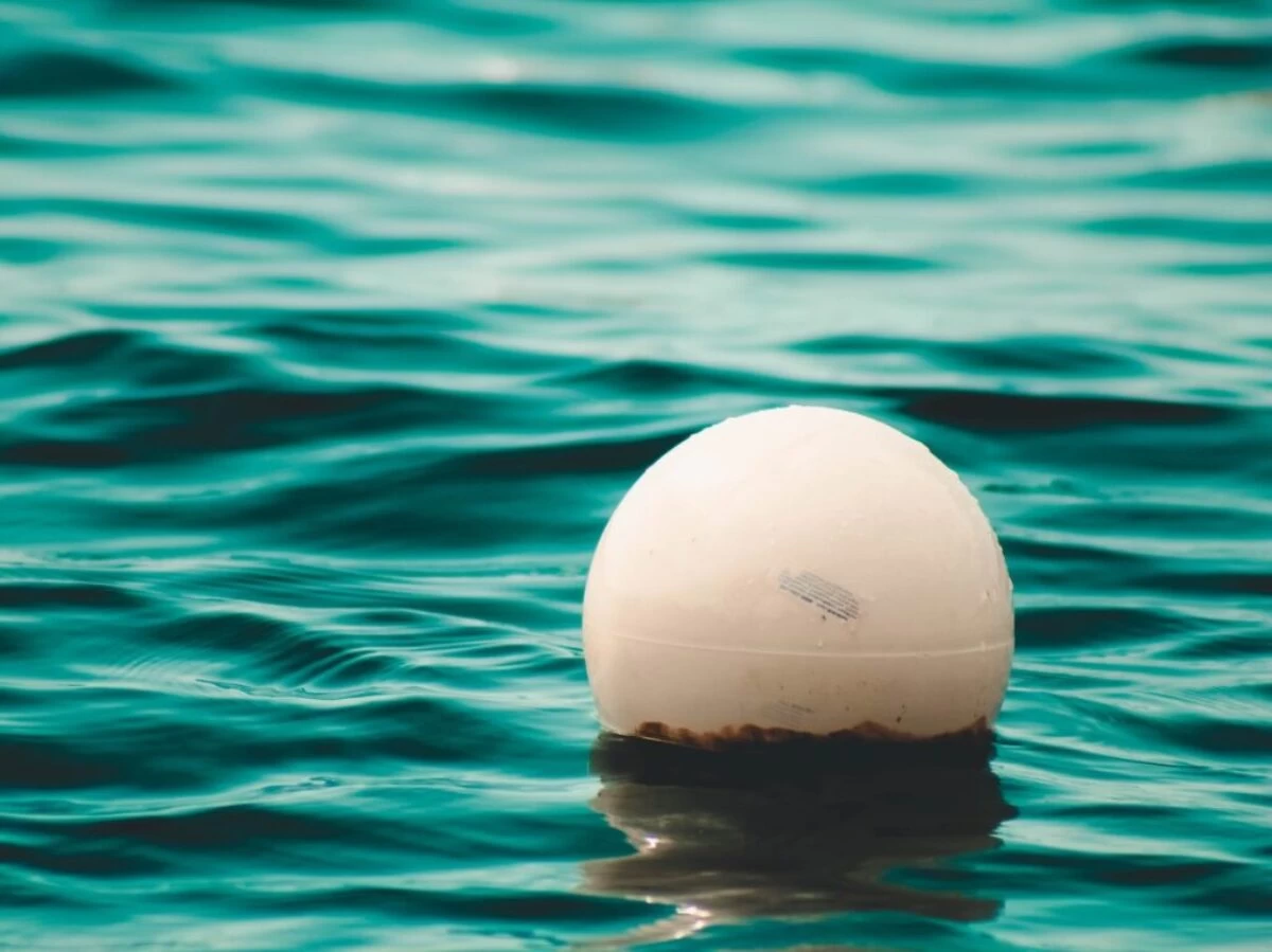 white ball floating on sea