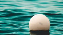 white ball floating on sea