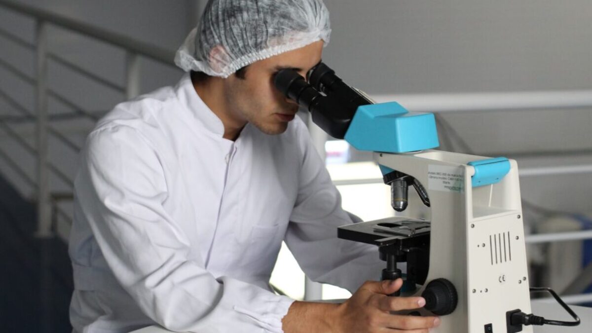 man sight on white microscope