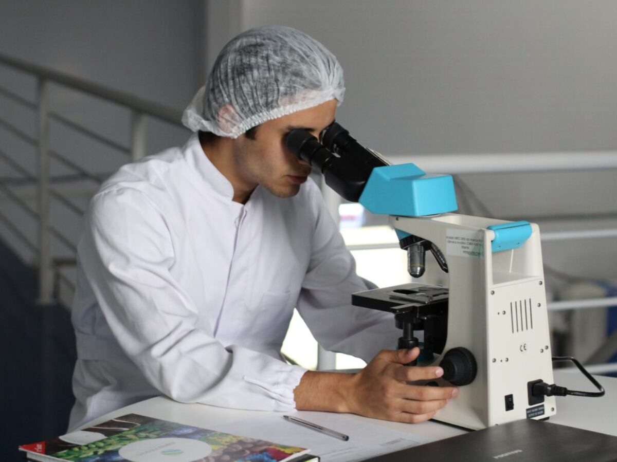 man sight on white microscope