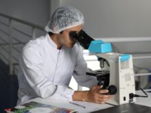 man sight on white microscope