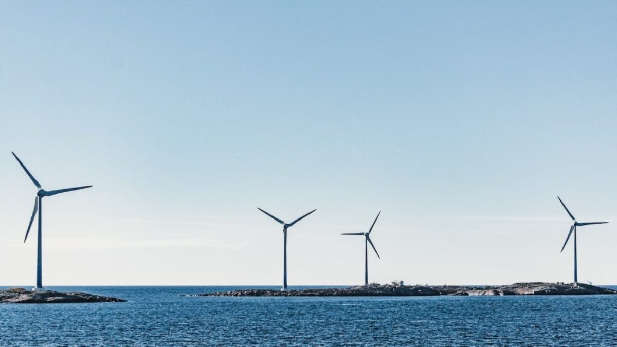wind turbines on blue sea under blue sky during daytime
