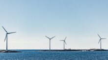 wind turbines on blue sea under blue sky during daytime
