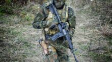 soldier holding rifle