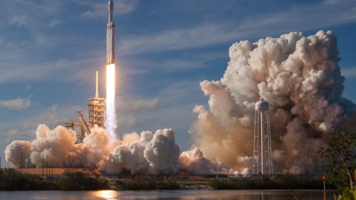 gray spacecraft taking off during daytime