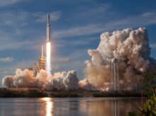 gray spacecraft taking off during daytime