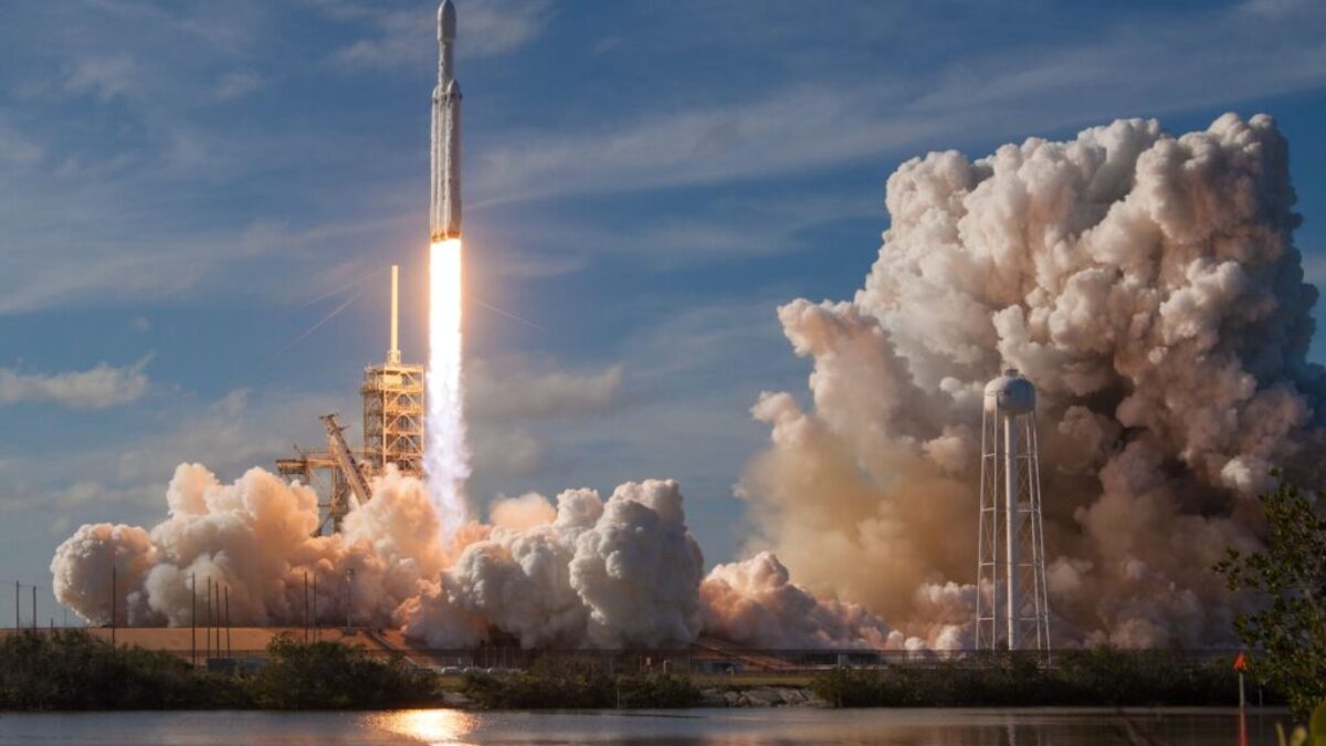 gray spacecraft taking off during daytime