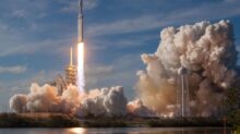 gray spacecraft taking off during daytime