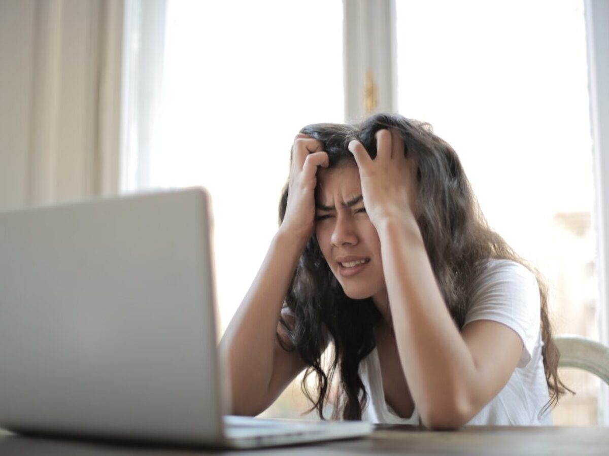 Woman in White Shirt Showing Frustration