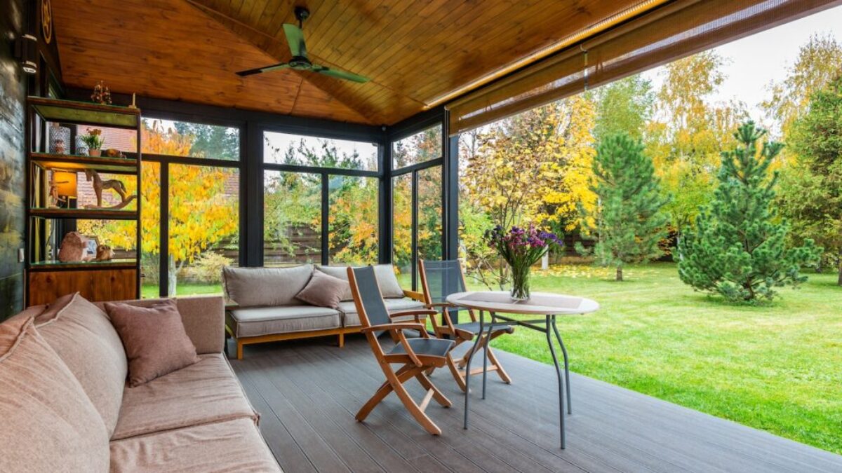 Terrace with comfortable couches and armchairs around table