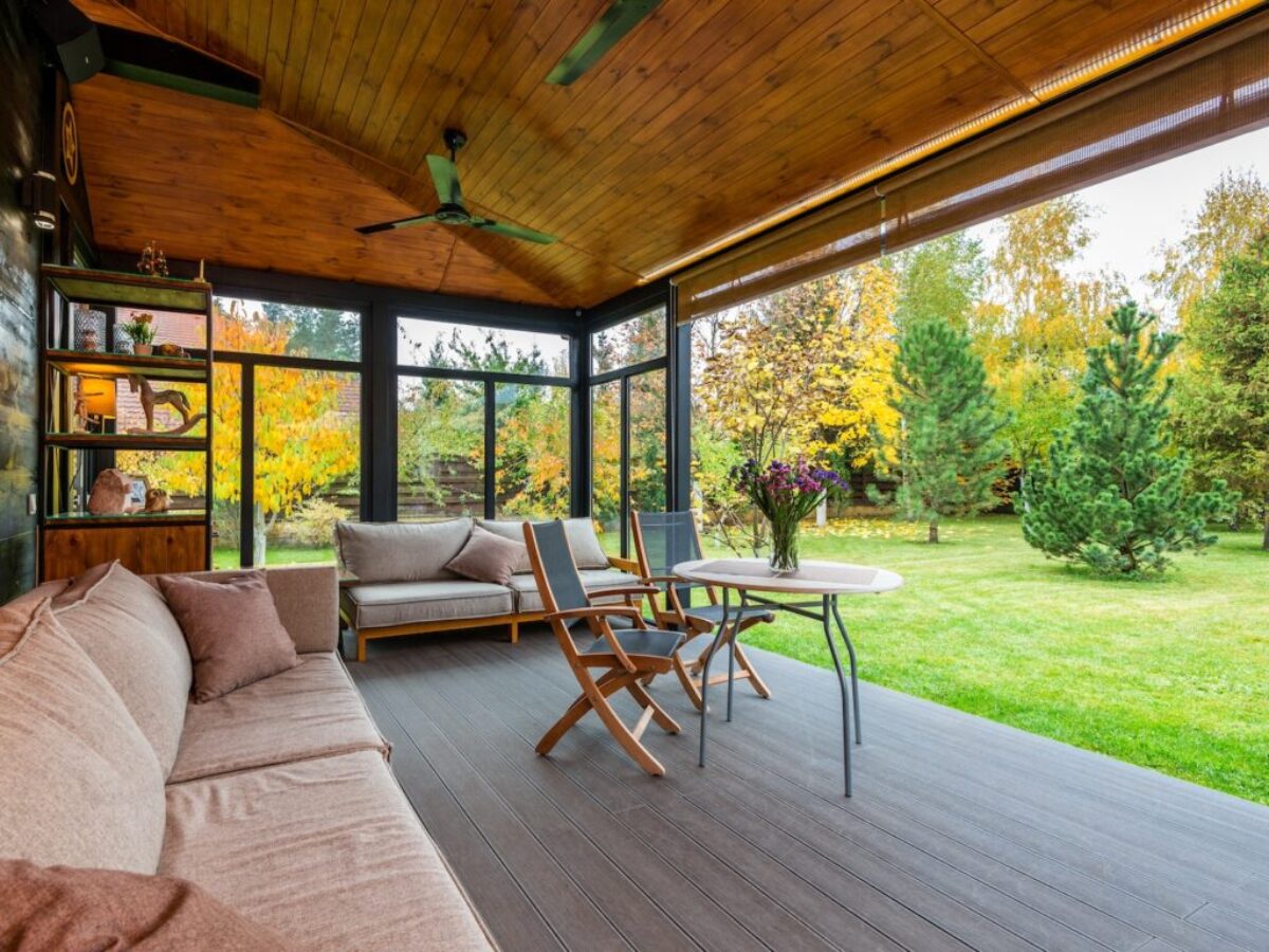 Terrace with comfortable couches and armchairs around table