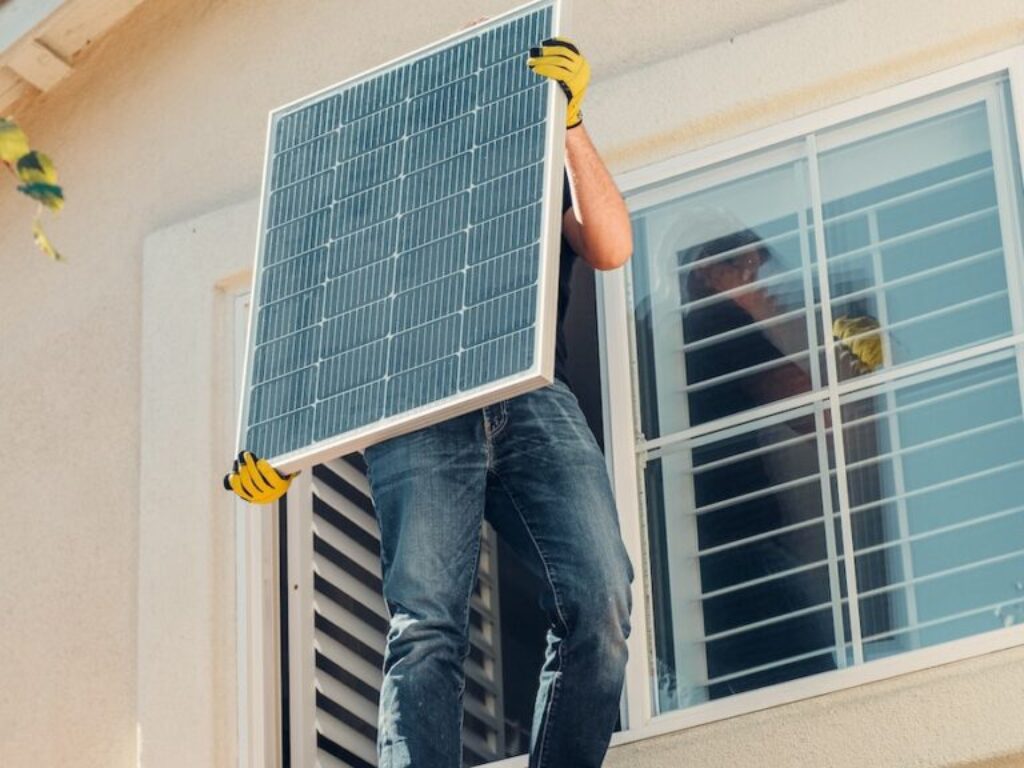 A Man Carrying Solar Panel