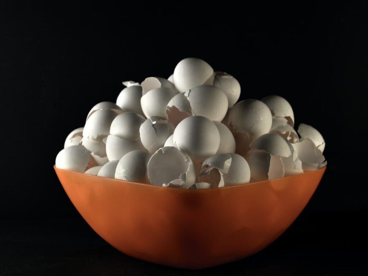 white egg on orange bowl