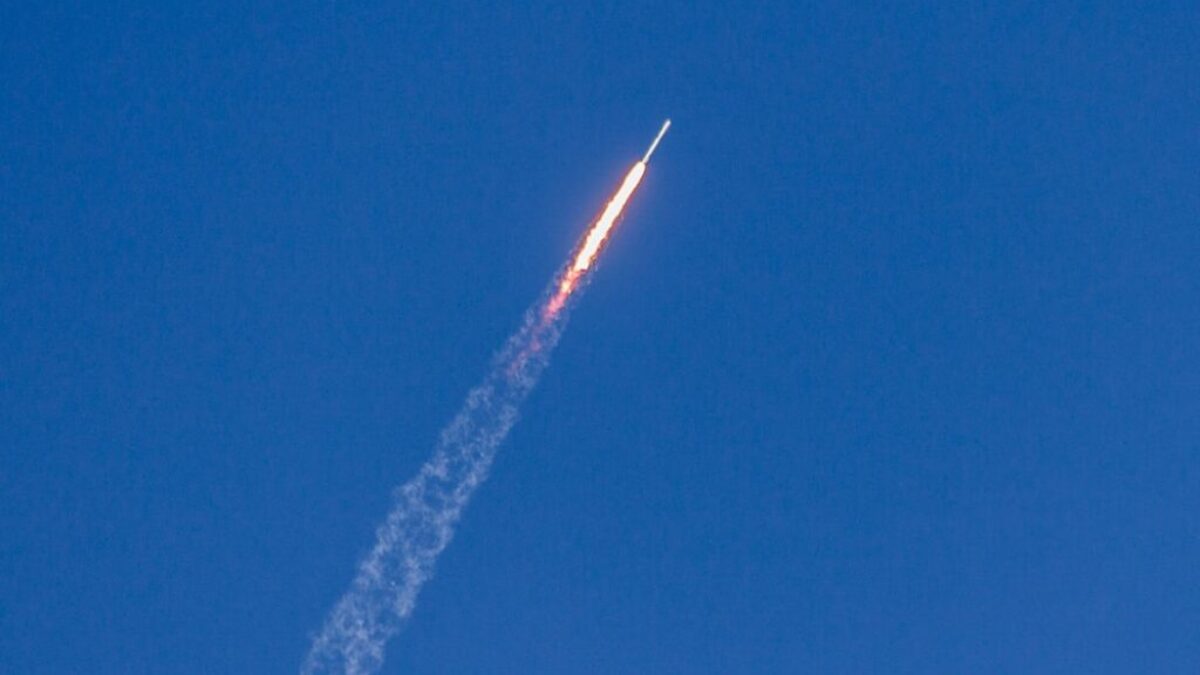 flying rocket during daytime