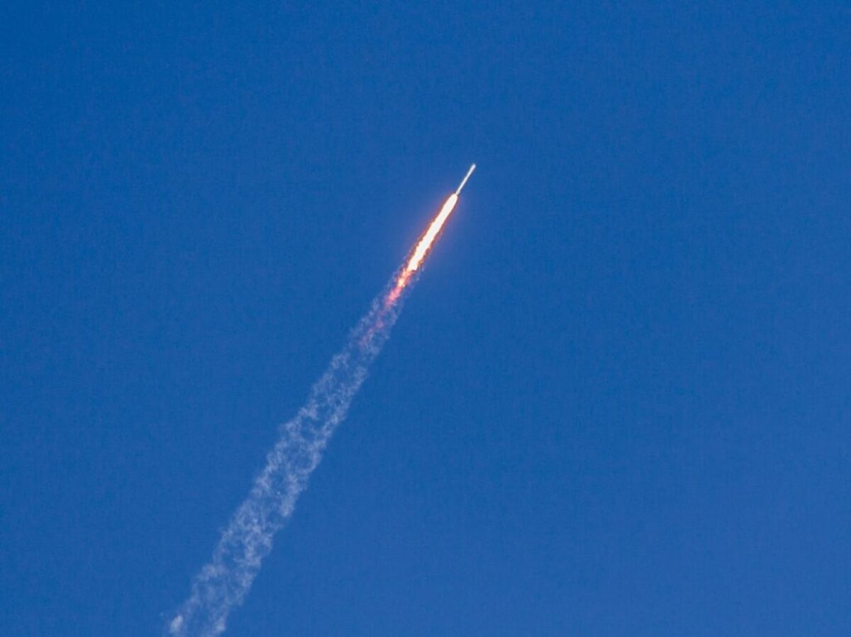 flying rocket during daytime