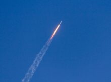 flying rocket during daytime