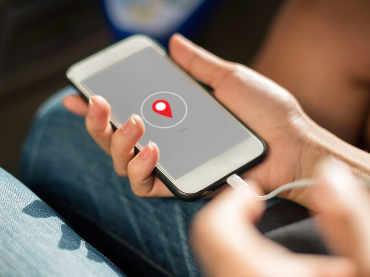 Close up of hands charging mobile phone