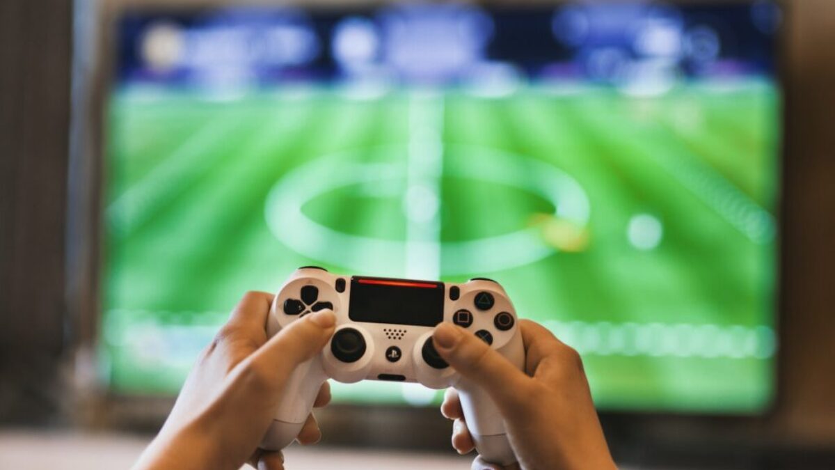 Person Holding Game Pad