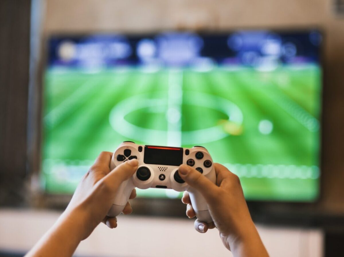 Person Holding Game Pad