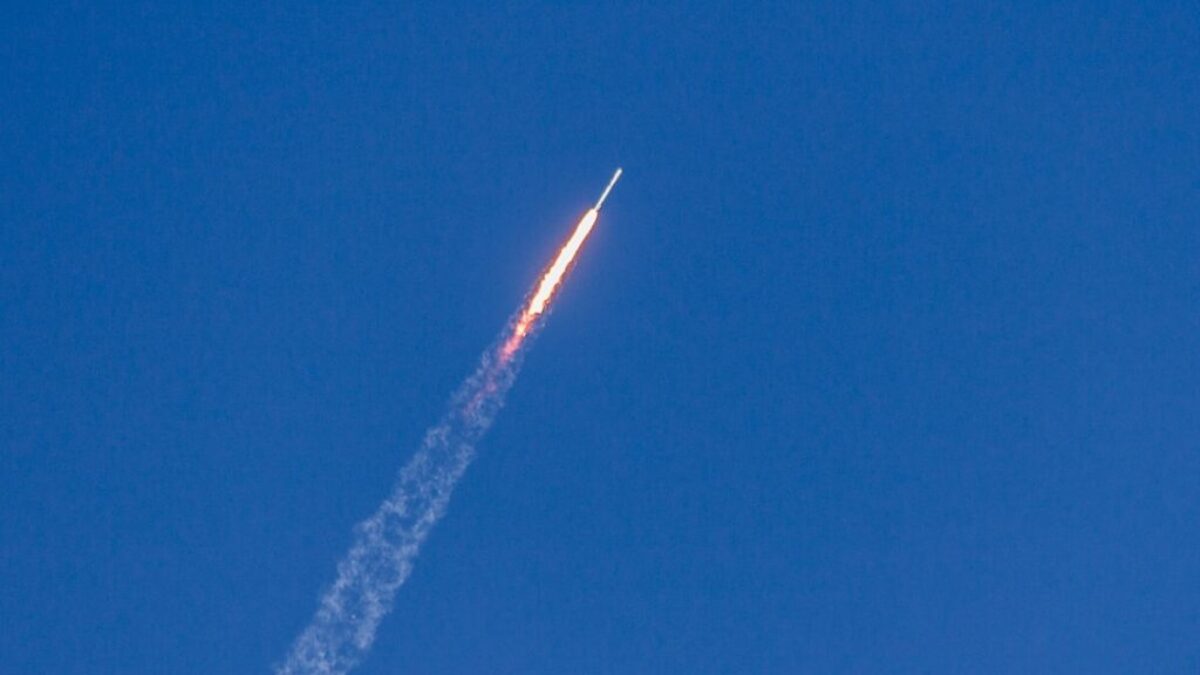 flying rocket during daytime