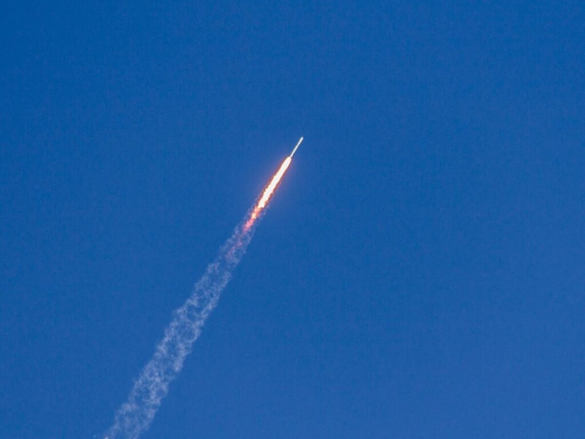 flying rocket during daytime