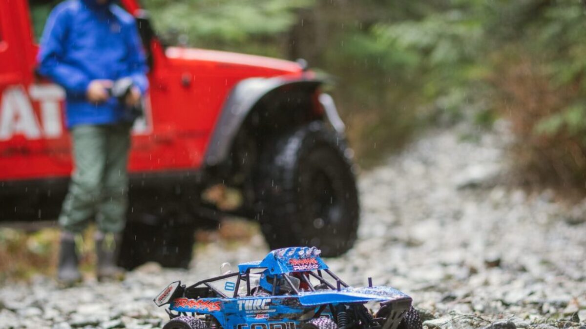 blue and black toy car on rocks