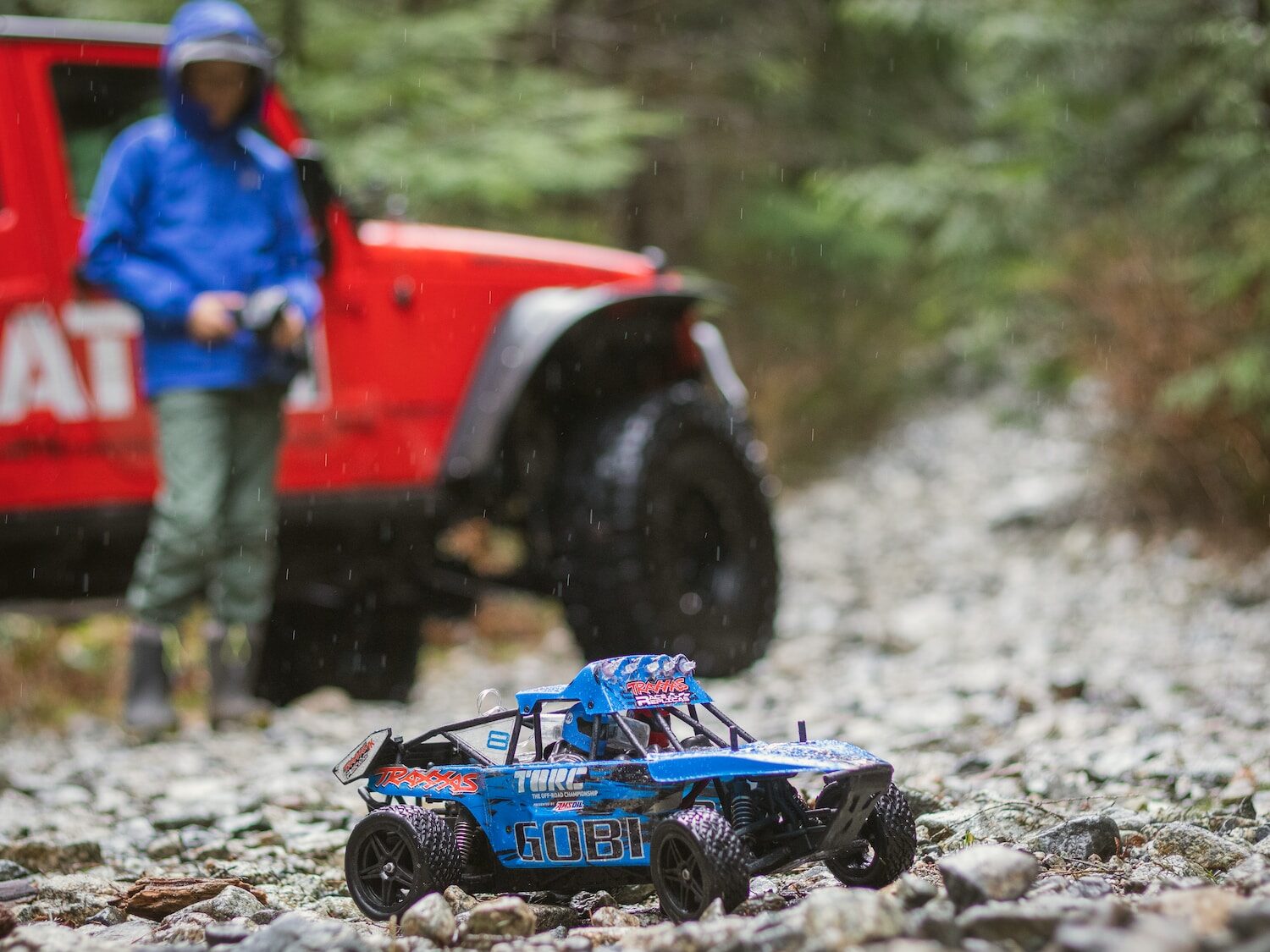 blue and black toy car on rocks