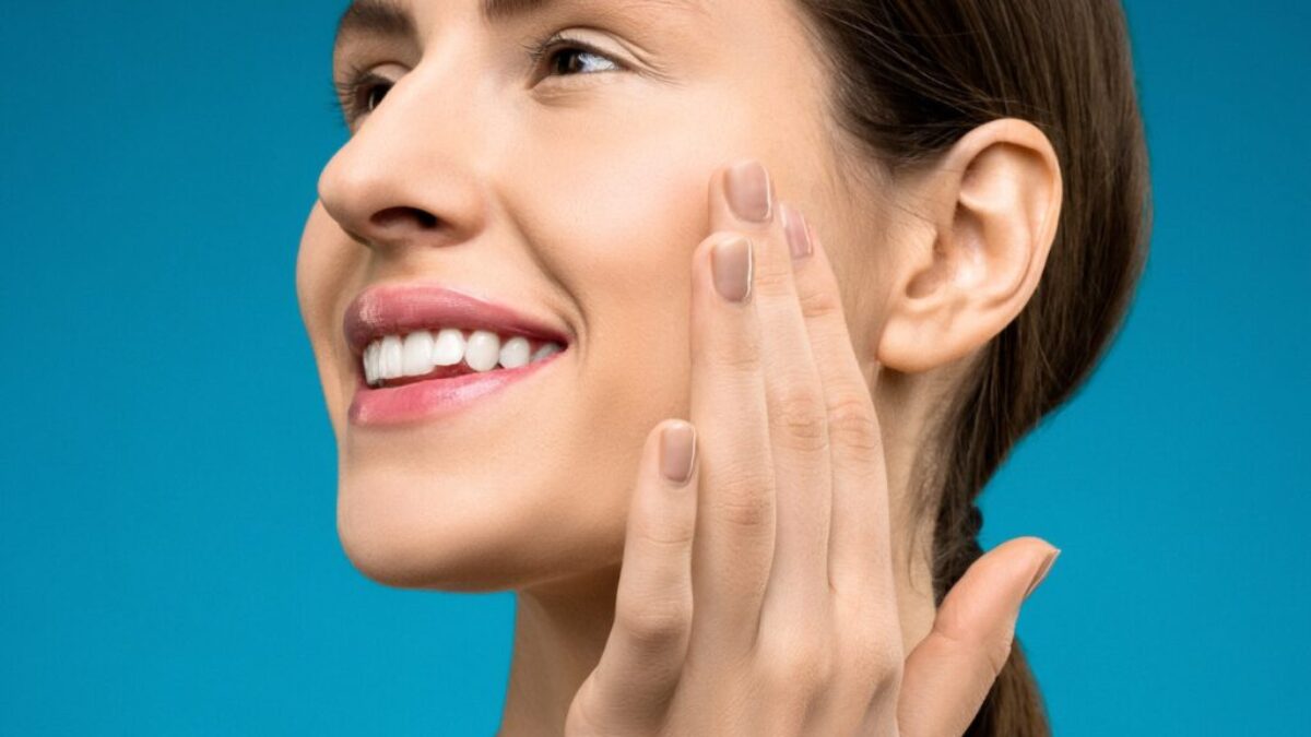 Woman Touching Her Cheeks