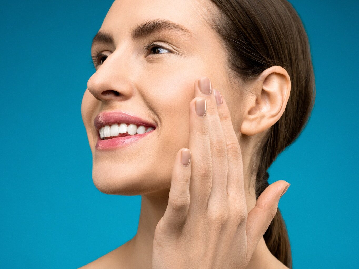 Woman Touching Her Cheeks
