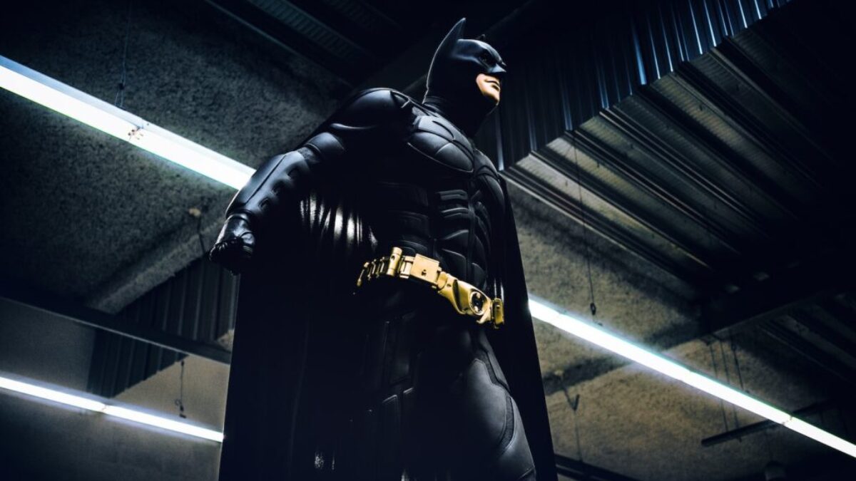 Batman standing under steel roof