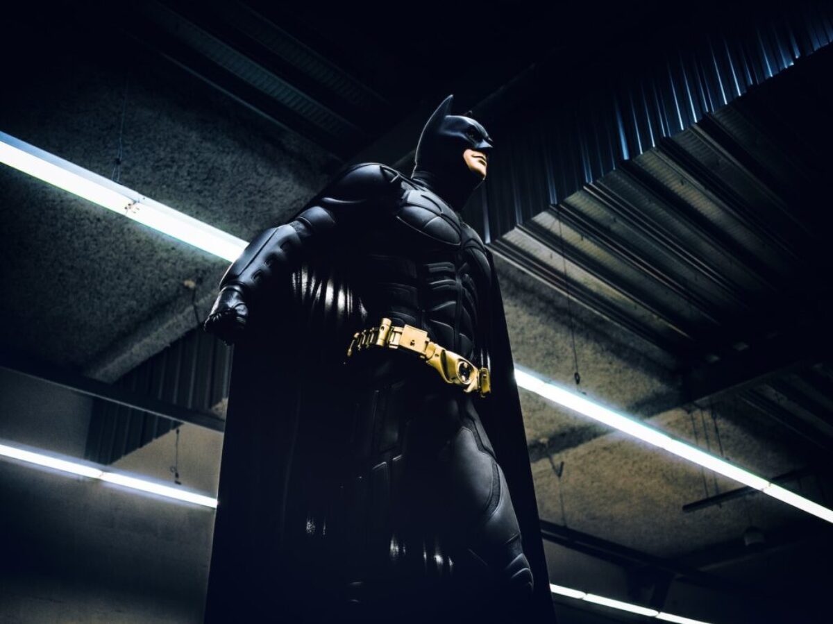 Batman standing under steel roof