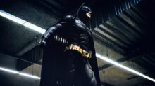Batman standing under steel roof