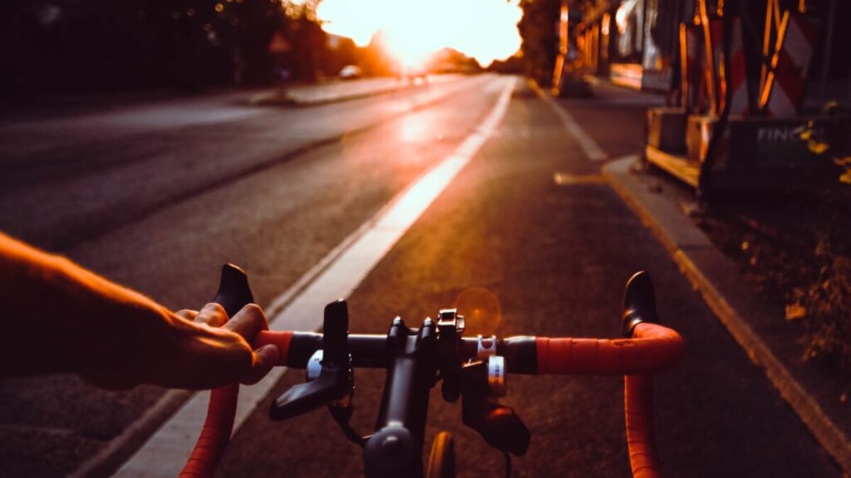 person riding on bicycle on road