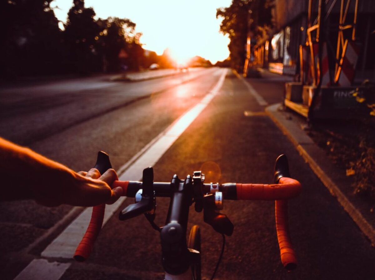 person riding on bicycle on road