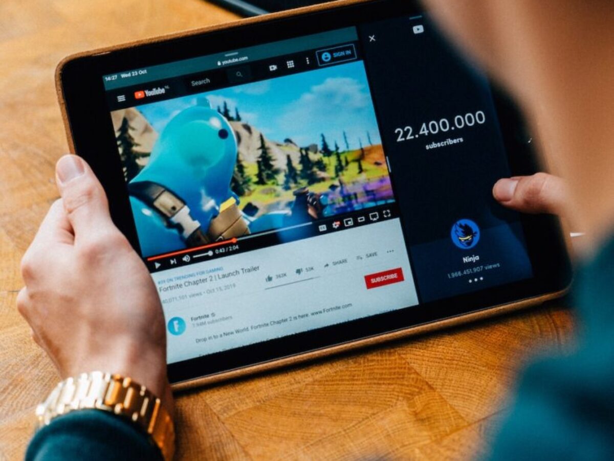 selective focus photography of person using tablet computer