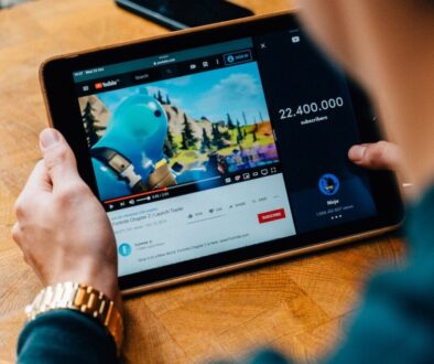 selective focus photography of person using tablet computer