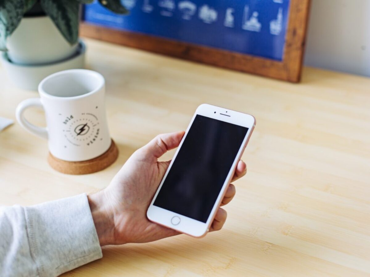 person holding rose gold iPhone 6