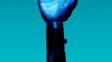 Prosthetic Arm on Blue Background