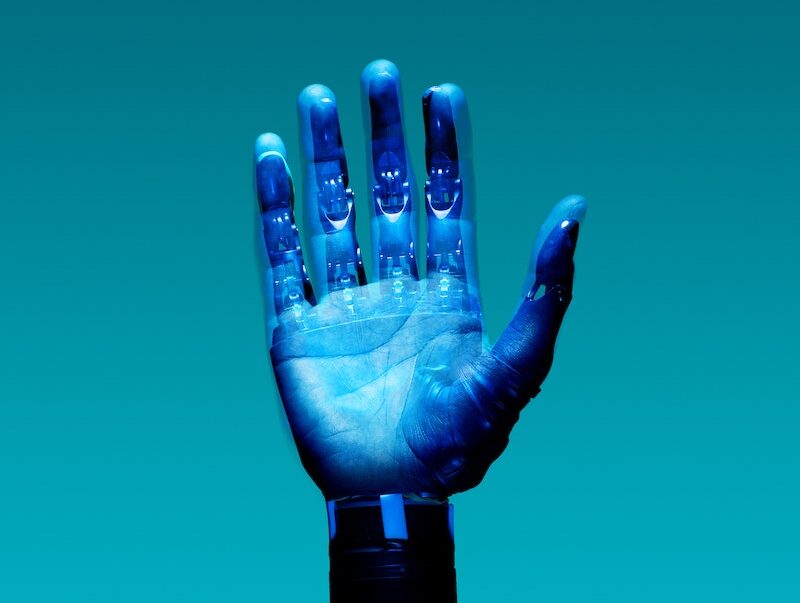 Prosthetic Arm on Blue Background