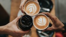 three person holding beverage cups