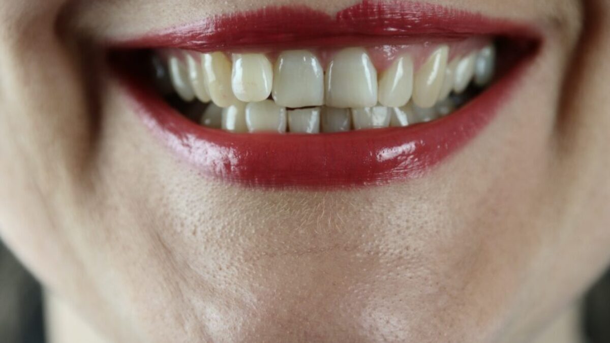 person with red lipstick and red lipstick