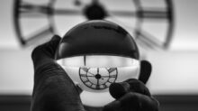 grayscale photography of person holding glass ball
