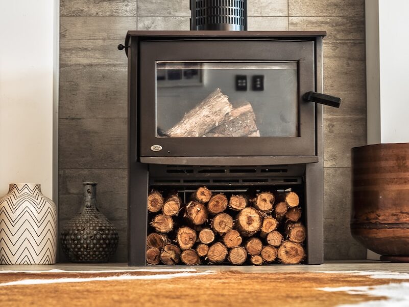 black wood burner near brown wooden pot